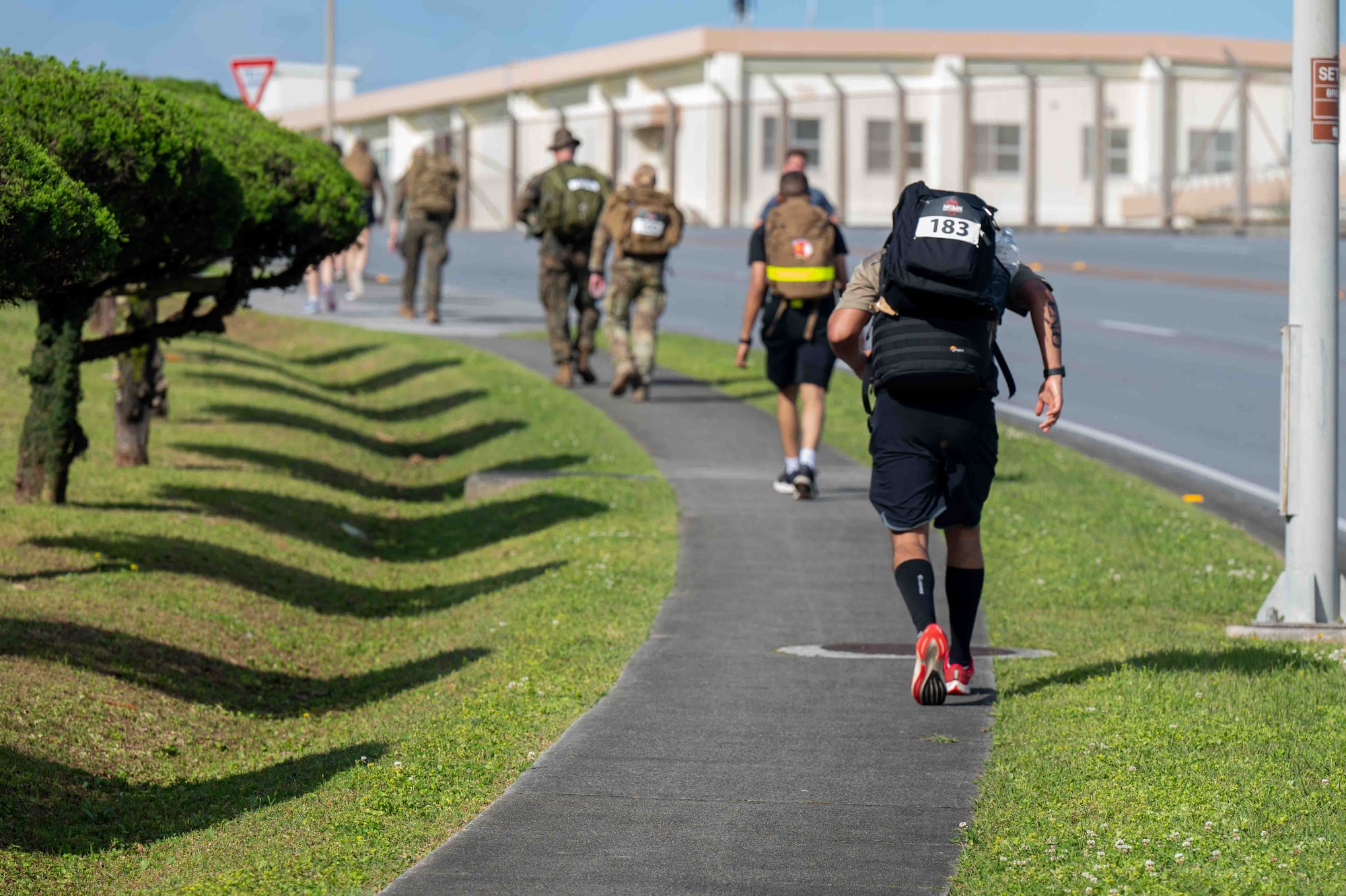 A service member is running for the Bataan march