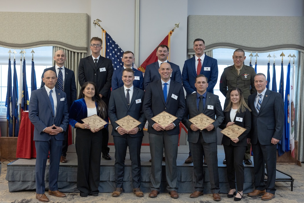 U.S. Marines with 2nd Marine Aircraft Wing (MAW) pose for a group photo during the 2nd MAW Marine Corps Aviation Association (MCAA) awards banquet at Marine Corps Air Station Cherry Point, North Carolina, April 17, 2025. The MCAA hosted the banquet to celebrate and recognize the Marines and units that have distinguished themselves within 2nd MAW as the best in Marine aviation. (U.S. Marine Corps photo by Cpl. David Ornelas Baeza)