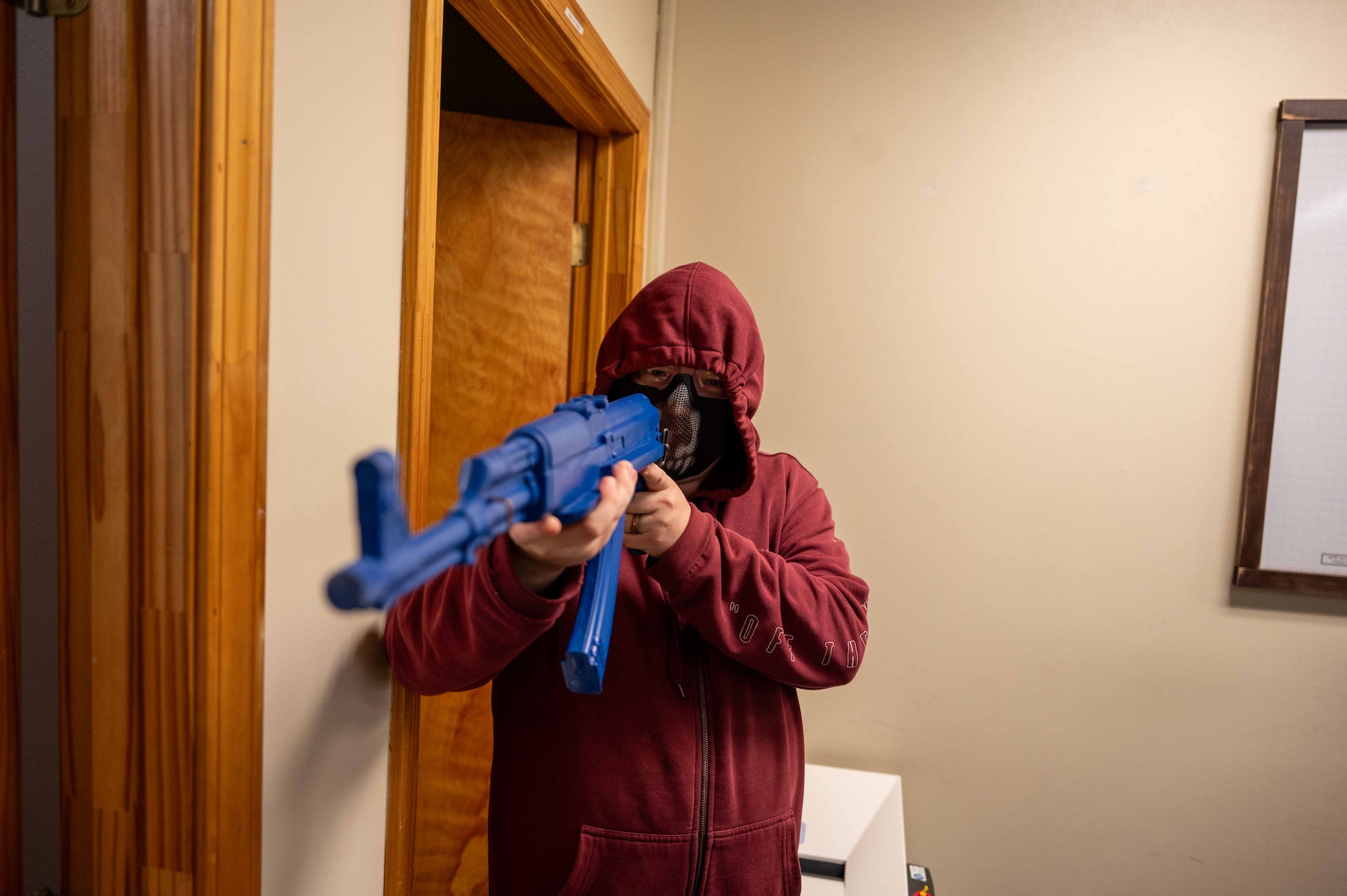 U.S. Air Force Airman 1st Class Alec Green, 42nd Contracting Squadron contracting specialist, acts as a simulated shooter during a MAXFORCE active shooter exercise at Maxwell Air Force Base, Alabama, April 15, 2025.