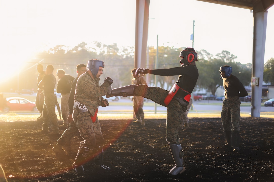 U.S. Marines with Marine Corps Air Station Beaufort, spar during a Marine Corps Martial Arts Program culminating event at MCAS Beaufort, South Carolina, March 14, 2025. The culminating events in MCMAP are intense, physically and mentally demanding exercises designed to test a Marine’s proficiency in the techniques, discipline, and warrior ethos associated with their current belt level, often incorporating realistic combat scenarios, endurance challenges, and evaluations by certified instructors.(U.S. Marine Corps photo by Cpl. Mason Coots)
