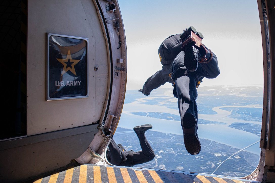U.S. Army soldiers with the U.S. Army Golden Knights parachute team egress from the sky during the 2025 Beaufort Air Show at Marine Corps Air Station Beaufort, South Carolina, April 13, 2025. The demonstration team excels under pressure performing for excited audiences at some of the largest festivals, airshows, and sporting events around the country. The team consists of twenty-six Soldiers and showcases the benefits of Army service with people everywhere through the sport of skydiving. (U.S. Marine Corps photo by Cpl. Sean LeClaire)