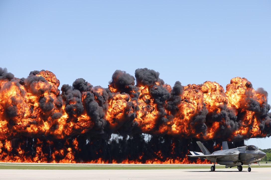A pyrotechnic display is triggered by Explosive Ordnance Disposal (EOD) technicians and Marine Air-Ground Task Force Demonstration Team during the 2025 Beaufort Airshow at Marine Corps Air Station Beaufort, South Carolina, April 13, 2025. The MAGTF is combined of four elements—Command Element, Ground Combat Element, Aviation Combat Element and Logistics Combat Element—that work seamlessly together. Within days, a MAGTF can be anywhere in the world and arrive ready to accomplish its mission. The MAGTF is the ideal rapid response team, able to quickly answer the call of duty, whatever it may be, wherever it may take them. (U.S. Marine Corps photo by Cpl. Delilah M. Romayor)
