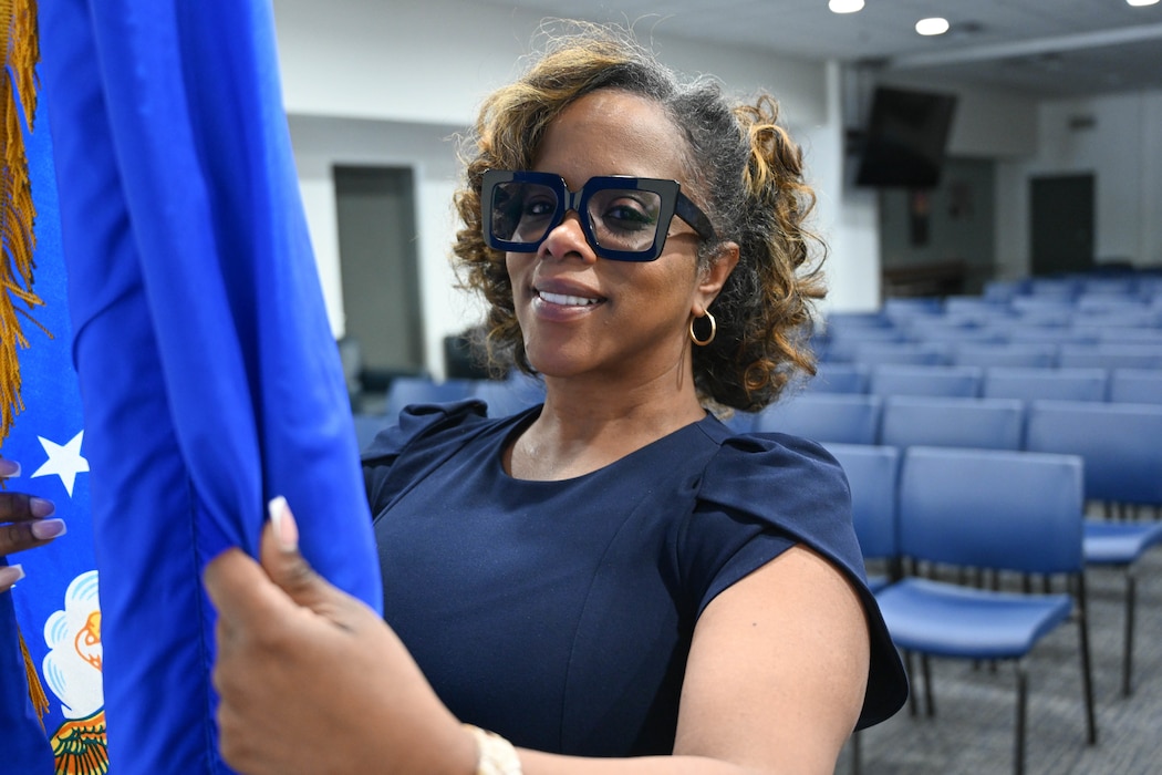A federal employee poses for a photo.