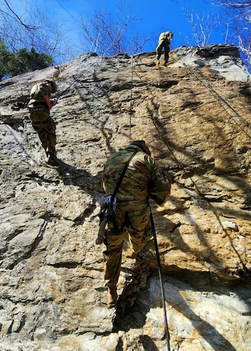 Students rappel down cliff