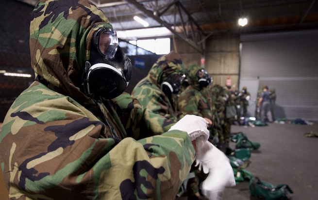Members of Coast Guard Cutter Munro conduct Chemical, Biological, Radiological, and Nuclear (CBRN) training (U.S. Coast Guard Photo Courtesy of Petty Officer 1st Class Kenneth Wiese).