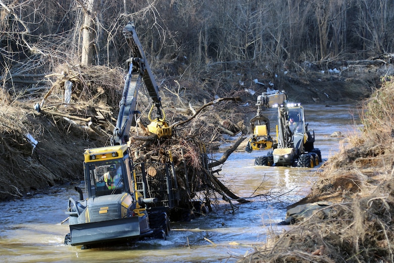 Contractors load waterway debris from the river near Azalea Park in Swannanoa North Carolina Feb. 1, 2025 where the waterway debris collection has begun in Buncombe County.