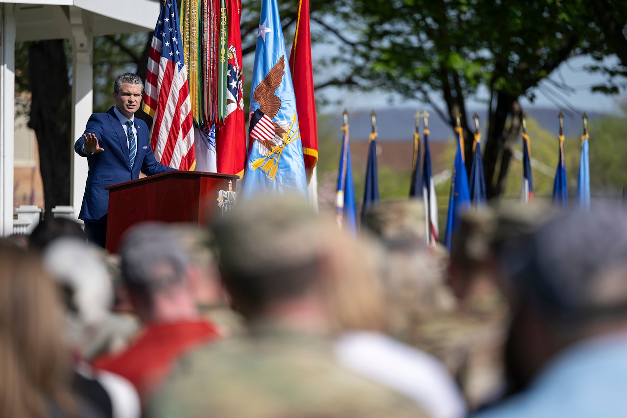 The defense secretary delivers remarks to an audience.