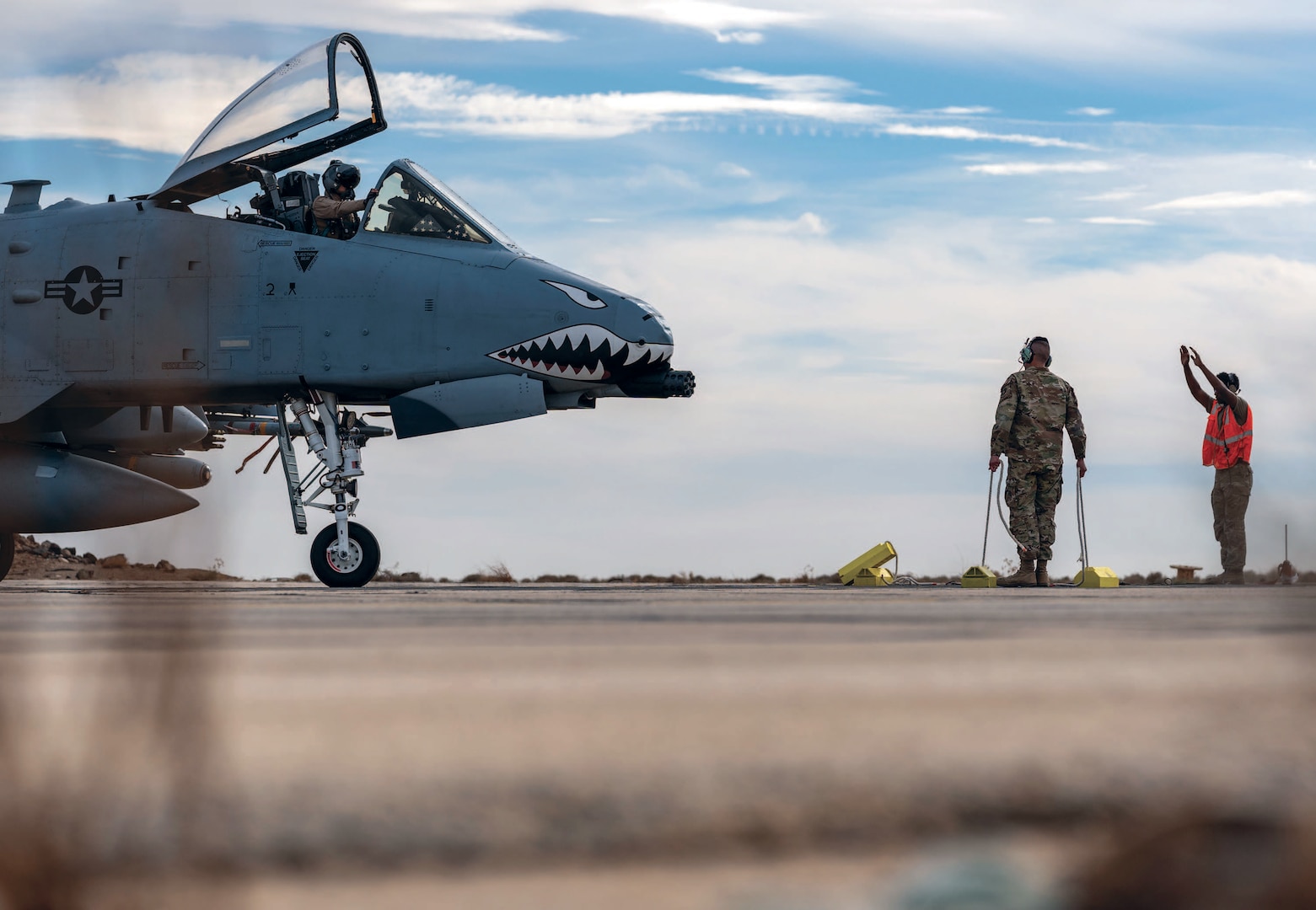 Air Force crew chiefs marshal A-10C Thunderbolt II during Agile Combat Employment exercise in austere location within U.S. Central Command area of responsibility, December 11, 2024