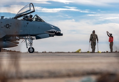 Air Force crew chiefs marshal A-10C Thunderbolt II during Agile Combat Employment exercise in austere location within U.S. Central Command area of responsibility, December 11, 2024