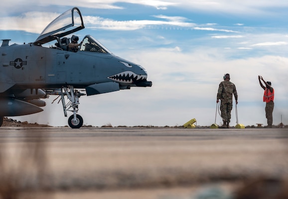Air Force crew chiefs marshal A-10C Thunderbolt II during Agile Combat Employment exercise in austere location within U.S. Central Command area of responsibility, December 11, 2024