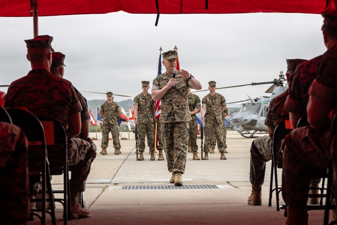 U.S. Marine Corps Col. Michael P. Brennan, the commanding officer of Marine Aircraft Group 41, 4th Marine Aircraft Wing, delivers remarks during a change of command ceremony at Marine Corps Air Station Camp Pendleton, Calif., April 13, 2025. During the ceremony, Lt. Col. Mark R. Mauberret relinquished command of HMLA-775 to Lt. Col. Jack R. Guevara. The ceremony represents the transfer of authority, responsibility, and accountability from the outgoing officer to the incoming commanding officer. (U.S. Marine Corps photo by Lance Cpl. Mhecaela J. Watts)
