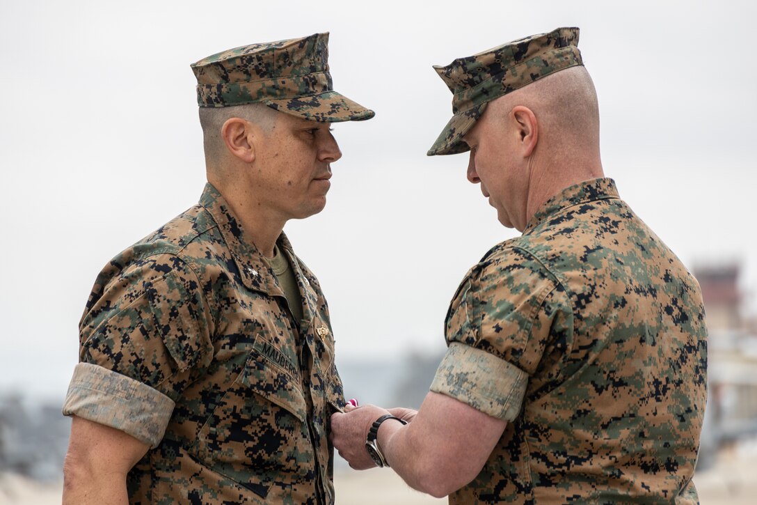 U.S. Marine Corps Lt. Col. Mark R. Mauberret, left, the outgoing commanding officer of Marine Light Helicopter Attack Squadron 775, Marine Aircraft Group 41, 4th Marine Aircraft Wing, receives the Meritorious Service Medal during a change of command ceremony at Marine Corps Air Station Camp Pendleton, Calif., April 13, 2025. During the ceremony, Lt. Col. Mark R. Mauberret relinquished command of HMLA-775 to Lt. Col. Jack R. Guevara. The ceremony represents the transfer of authority, responsibility, and accountability from the outgoing officer to the incoming commanding officer. (U.S. Marine Corps photo by Lance Cpl. Mhecaela J. Watts)