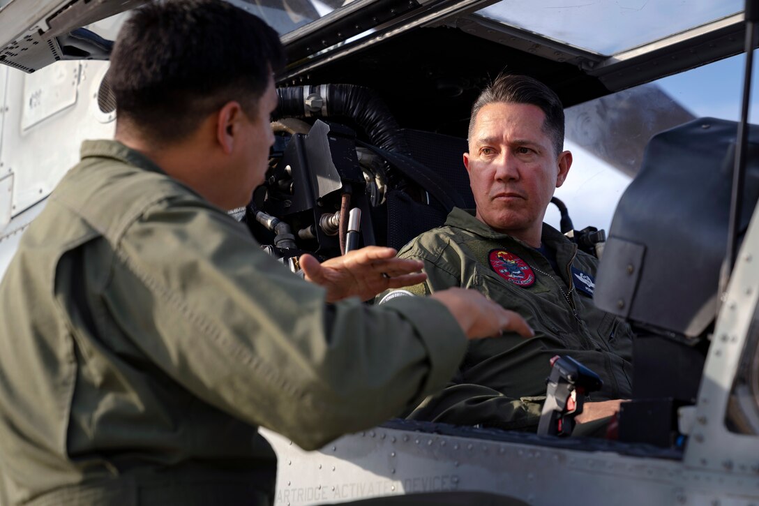 Colombian Air Force Brig. Gen. Alejandro Vélez, Combat Air Command No. 2 commander, sits in the cockpit of a U.S. Marine Corps AH-1Z Viper helicopter during an exchange with Red Flag-Rescue 23-1 exercise participants at Davis-Monthan Air Force Base, Ariz., May 16, 2023. The multilateral combat search and rescue exercise is designed to enhance interoperability with joint-services alongside allied and partner nations. (U.S. Air Force Photo by Tech. Sgt. Rachel Maxwell)
