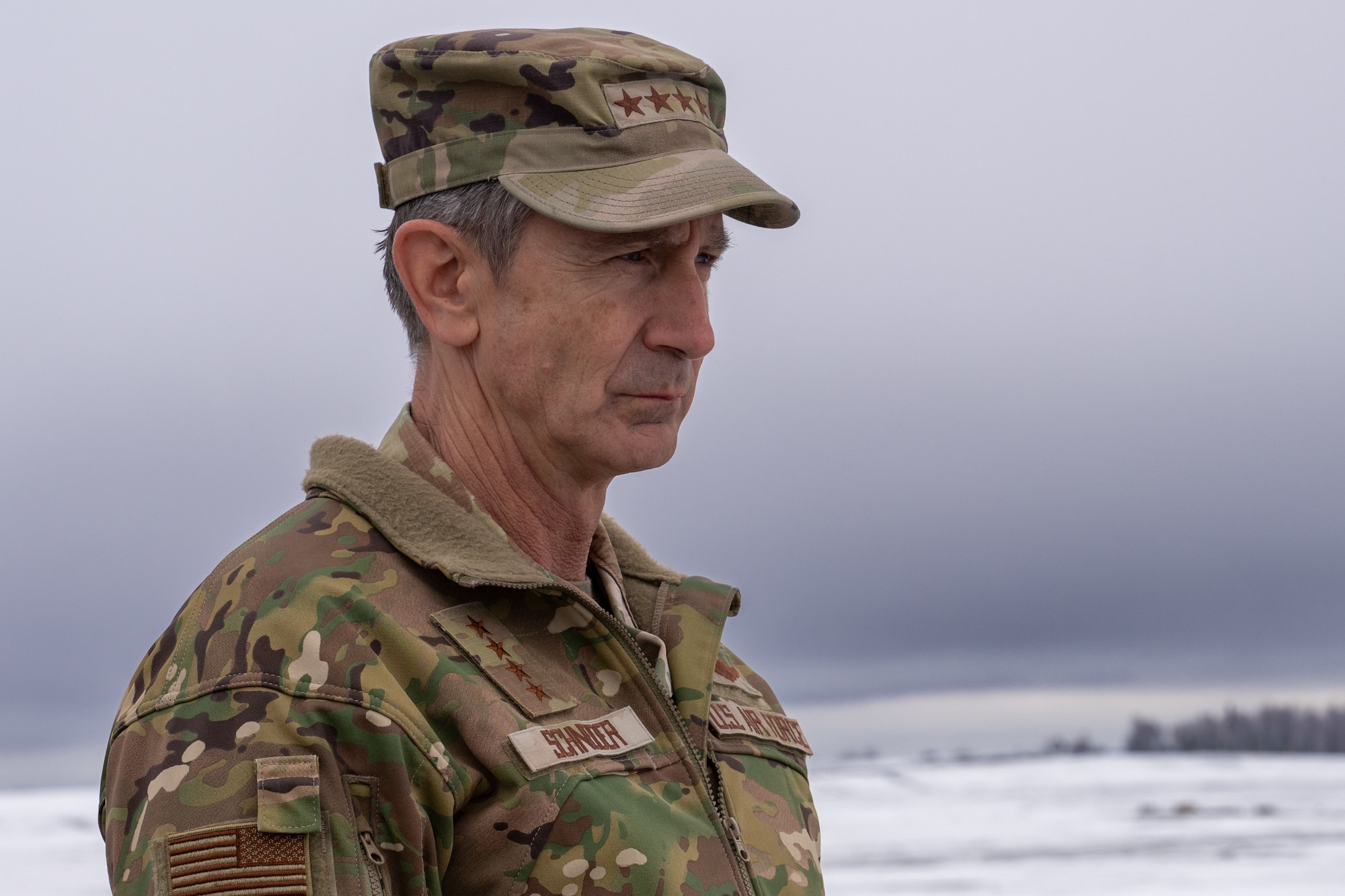 U.S. Air Force Gen. Kevin Schneider, Pacific Air Forces commander, attends a briefing to discuss the plans for extending the flightline and enhancing the installation at Joint Base Elmendorf-Richardson, Alaska, April 10.