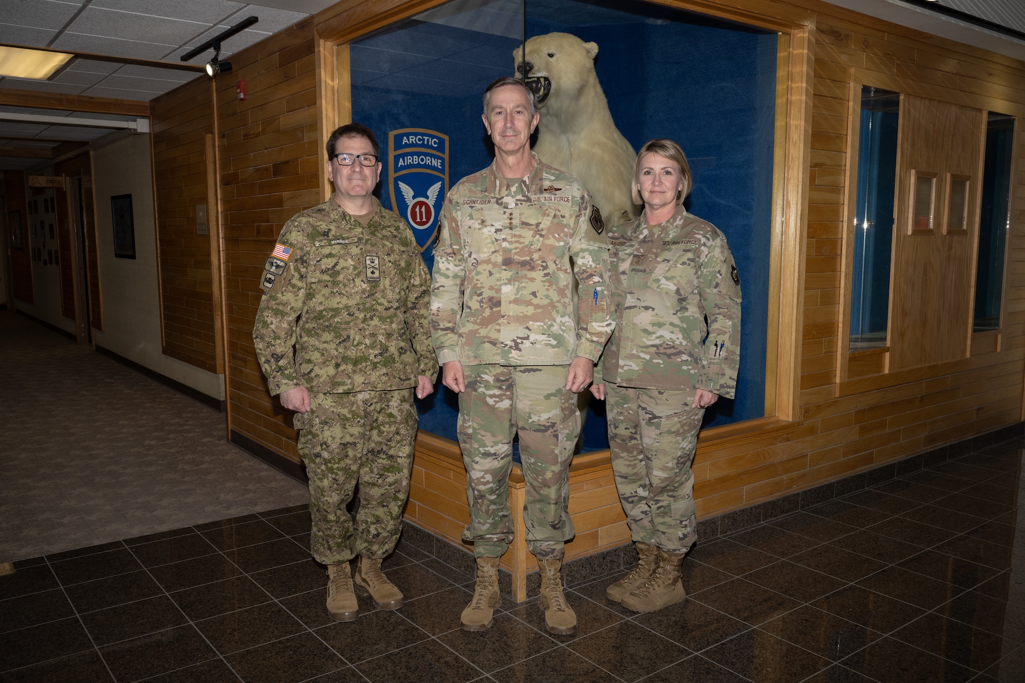 From left: Canadian Army Brig. Gen. McBride, 11th Airborne Division deputy commanding general of operations; U.S. Air Force Gen. Kevin Schneider, Pacific Air Forces commander; and Chief Master Sgt. Katie McCool, PACAF command chief master sergeant; visit the 11th Airborne Division headquarters on Joint Base Elmendorf-Richardson, Alaska, April 10, for a briefing on division mission and priorities.