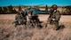 91st Missile Security Operations Squadron Tactical Response Force defenders prepare to advance uphill as a 550th Helicopter Squadron MH-139 Grey Wolf readies for takeoff during the Nuclear Convoy Course at Camp Guernsey Joint Training Center’s North Training Area, Wyoming, April 7, 2025. The 91 MSOS TRF air insertion marked the start of their participation in the NCC, a multi-day exercise sharpening convoy security, tactical response, and nuclear surety capabilities. (U.S. Air Force photo by Staff Sgt. Michael A. Richmond)