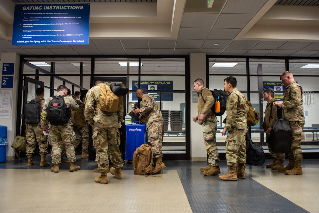Airmen waiting in line at passenger terminal