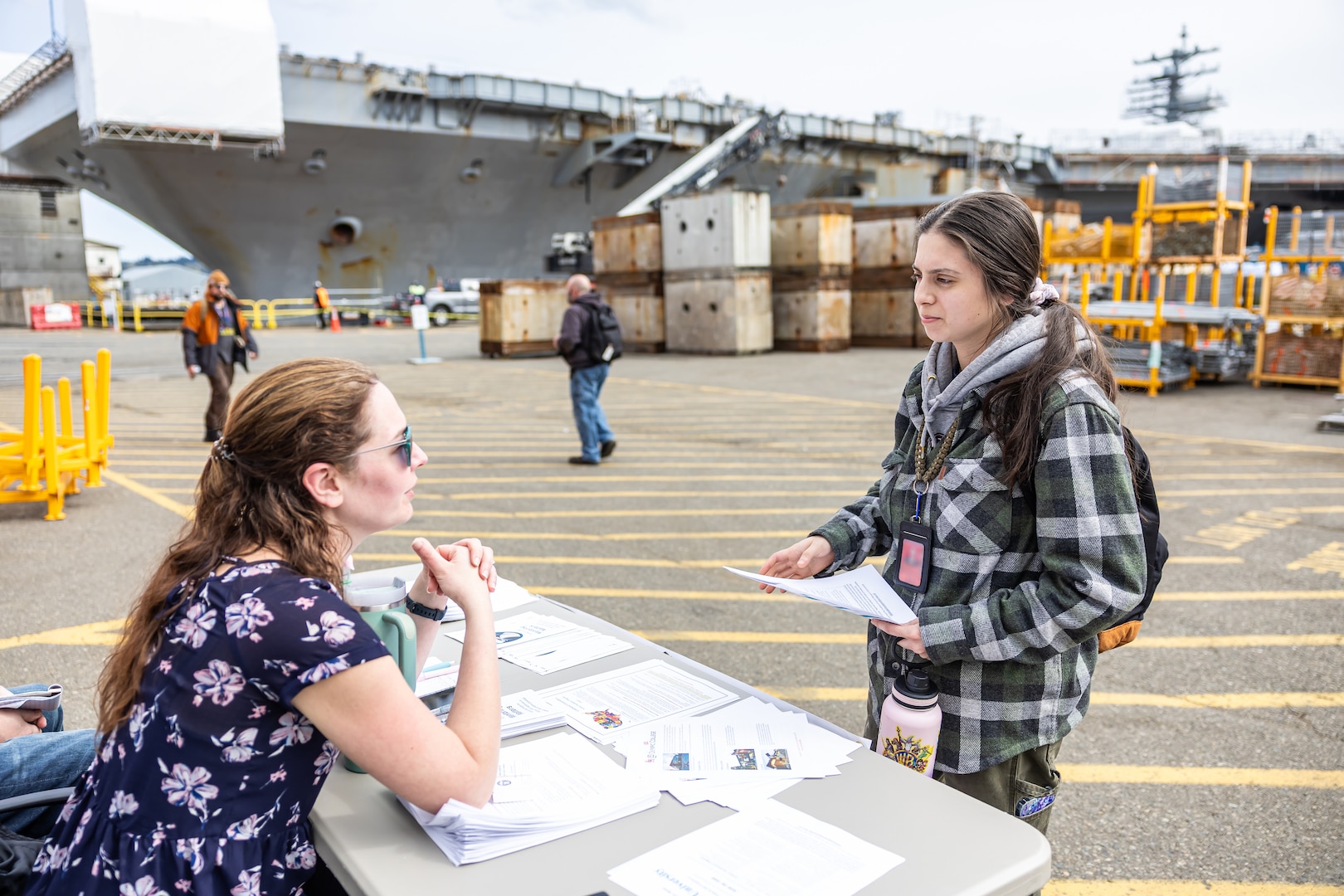 Patricia Leiataua, career counselor, Command Career Center, talks with Alanna Lopez, welder, Shop 26, Welders, about her career, April 9, 2025, during a “pop-up” knowledge share event at Puget Sound Naval Shipyard & Intermediate Maintenance Facility in Bremerton, Washington. (U.S Navy photo by Jeb Fach)