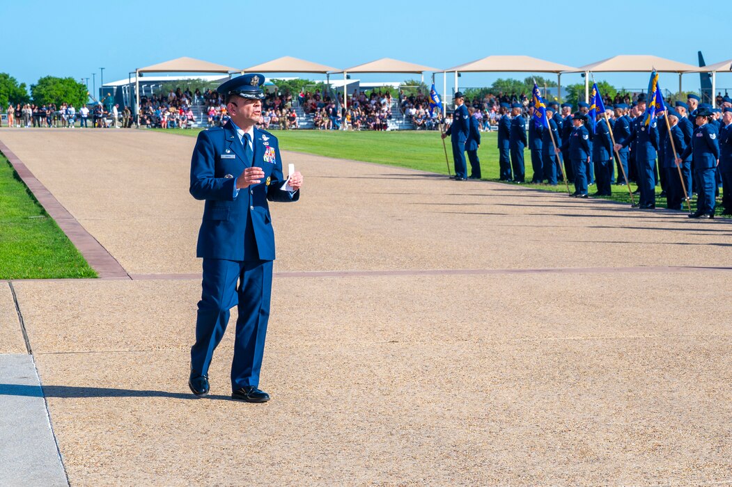 U.S. Air Force Col. Sergio Anaya, 62d Airlift Wing commander, gives his remarks as the reviewing official during the April 10th Basic Military Training graduation parade at Joint Base San Antonio-Lackland, Texas, April 10, 2025.