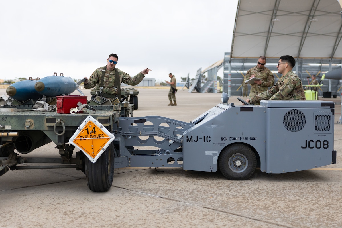 U.S. Air National Guard members assigned to the 162nd Wing gather for the annual Weapons Load Competition at Morris Air National Guard Base, Ariz., Apr. 4, 2025. Load Crew Chiefs were tested with a written portion in addition to loading the BDU-50, a 500-pound training munition. (U.S. Air National Guard photo by Tech. Sgt. Hampton Stramler)