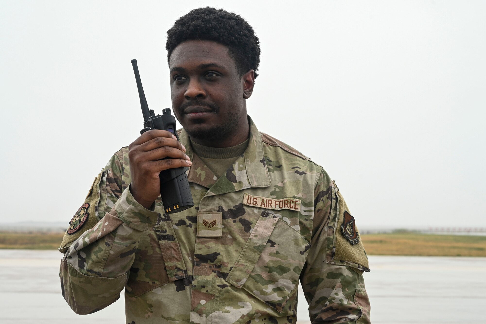 Senior Airman Morisse Daniels, 8th Operations Support Squadron airfield management operations supervisor, relays information on a radio to the airfield management operations center during Freedom Flag 25-1 at Kunsan Air Base, Republic of Korea, April 22, 2025.