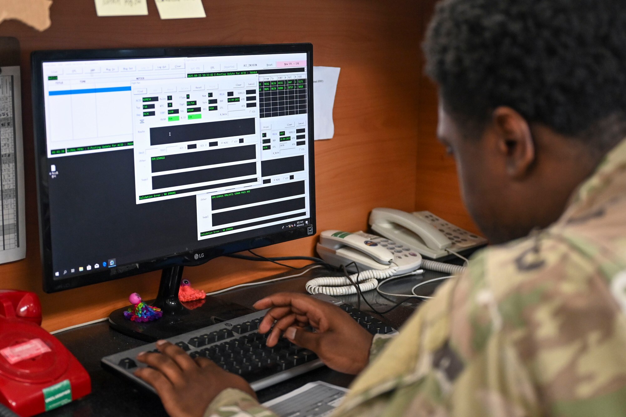 Senior Airman Morisse Daniels, 8th Operations Support Squadron airfield management operations supervisor, enters information into a flight data terminal during Freedom Flag 25-1 at Kunsan Air Base, Republic of Korea, April 22, 2025.