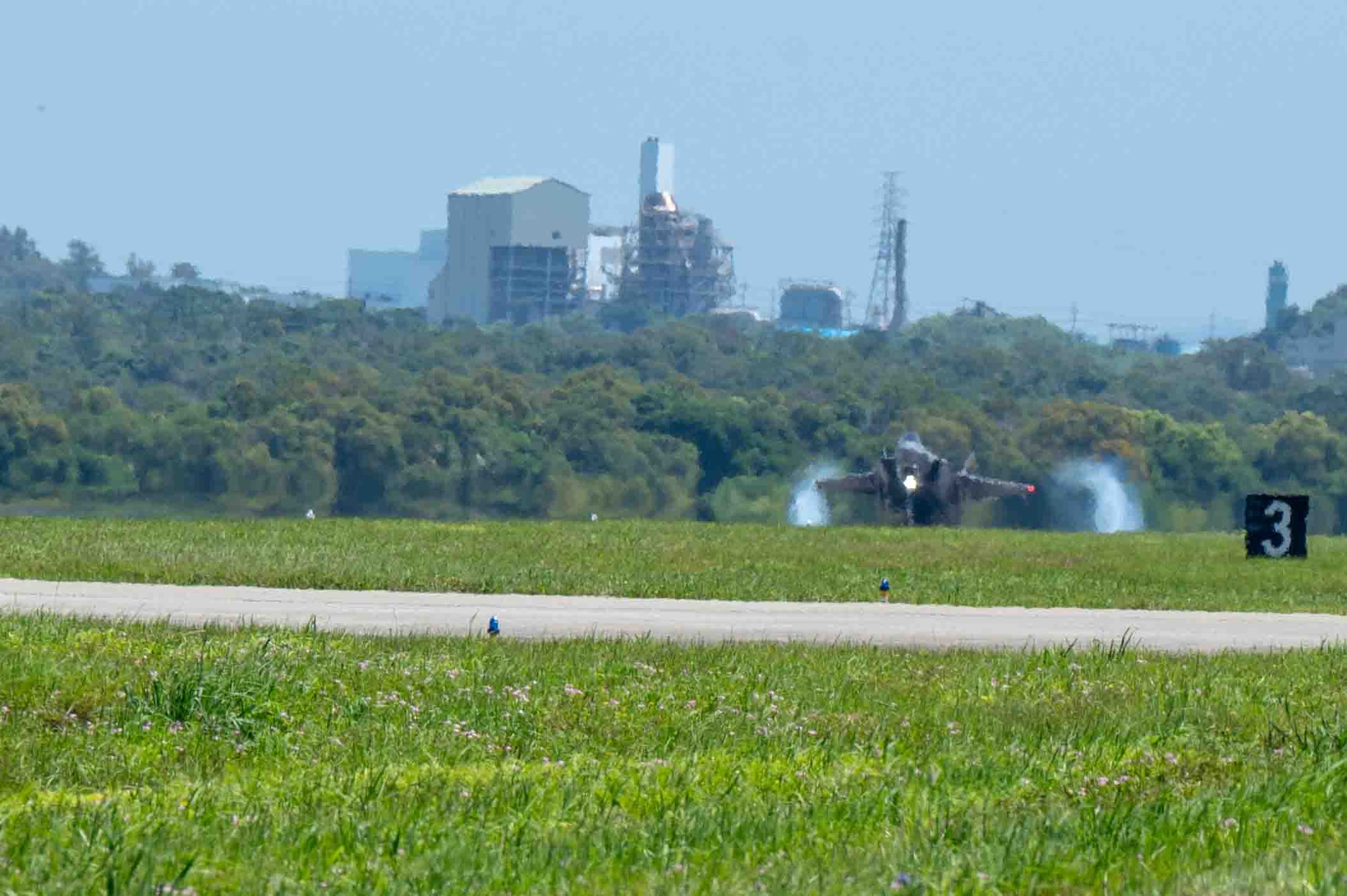 Aircraft lands on the flight line.