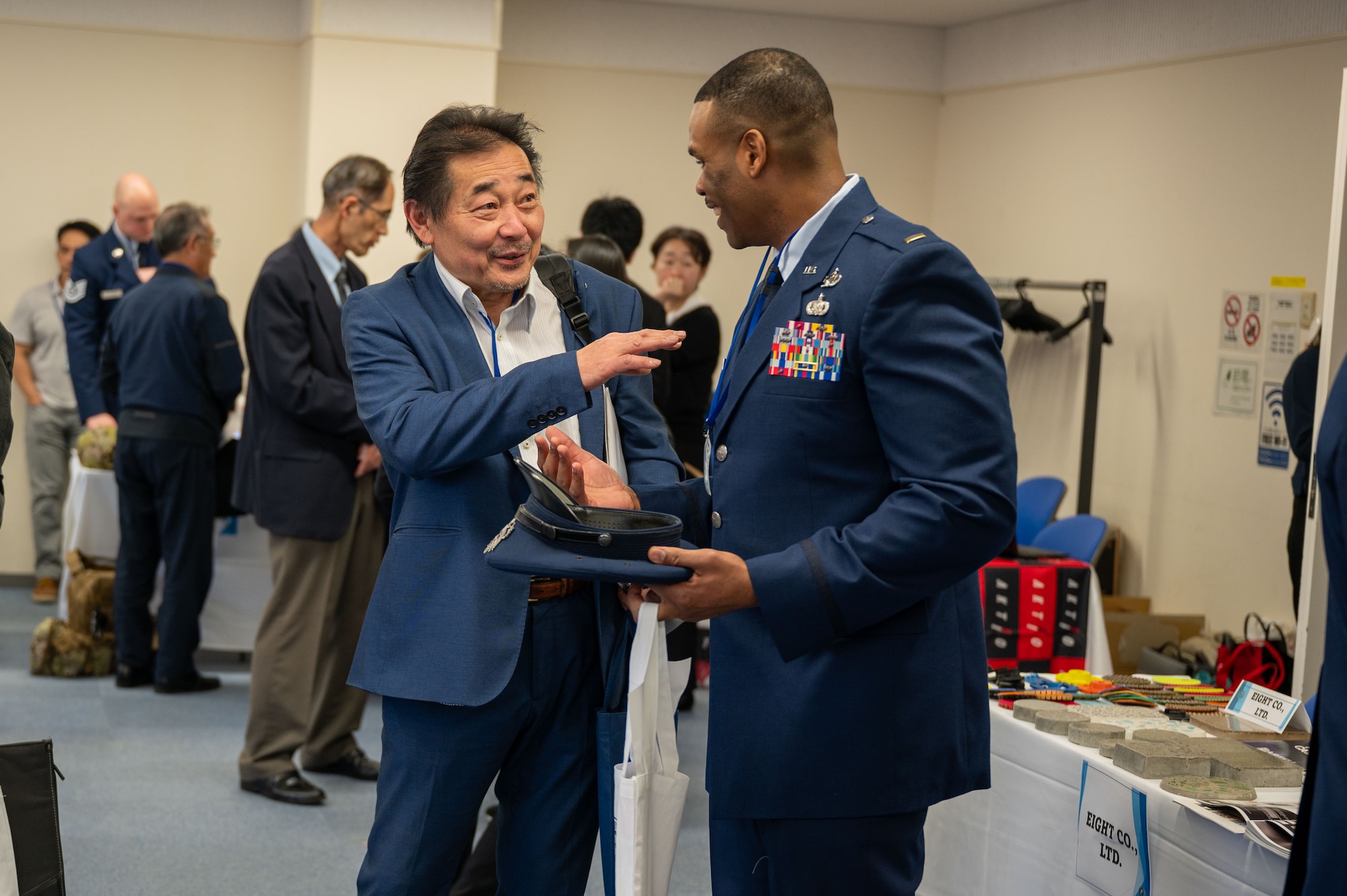 A local Japanese business representative speaks with a U.S. Air Force officer during Industry Day at Misawa International Center, April 18, 2025. The event served as a key engagement to strengthen economic ties, enhance mission readiness and promote long-term collaboration between the 35th Fighter Wing and regional industry partners. (U.S. Air Force photo by Senior Airman William Rodriguez)