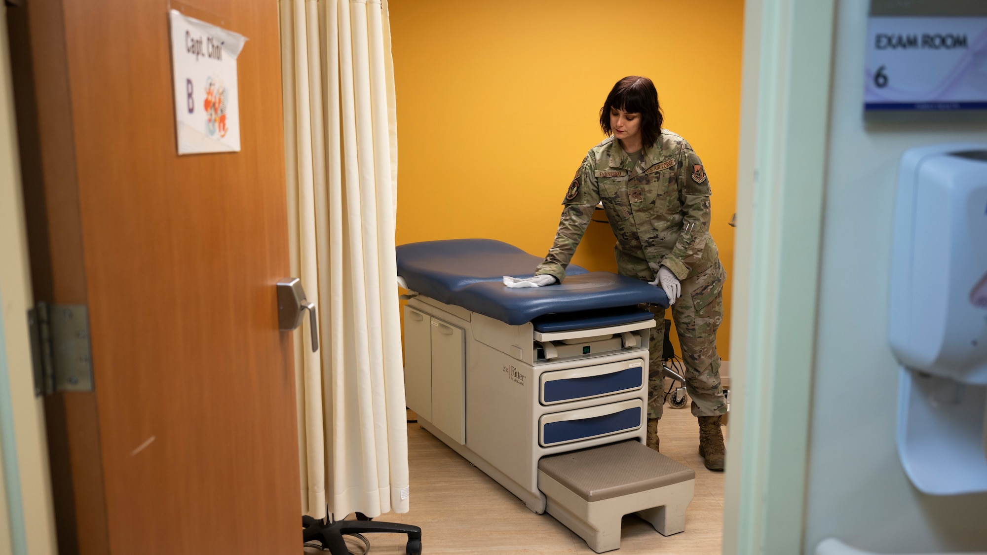 U.S. Air Force Staff Sgt. Maegan Evanisko, 51st Operational Medical Readiness Squadron aerospace medical technician, cleans an exam chair at Osan Air Base, Republic of Korea, April 22, 2025. Her daily responsibilities support the medical readiness of active duty personnel by coordinating care, managing referrals, and ensuring service members are mission-ready. (U.S. Air Force photo by Senior Airman Rome Bowermaster)