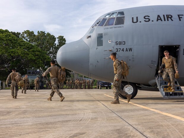 U.S. Marines with Marine Rotational Force – Darwin 25.3 disembark a U.S. Air Force C-130J with 36th Airlift Squadron, 374th Airlift Wing after their arrival to Puerto Princesa, Palawan, Philippines, from Mindanao for Balikatan 2025, April 15, 2025. Balikatan is a longstanding annual exercise between U.S. and Philippine armed forces designed to strengthen the alliance, showcase the capable combined force, and demonstrate the commitment to regional security and stability. (U.S. Marine Corps photo by Sgt. Ezekieljay Correa)