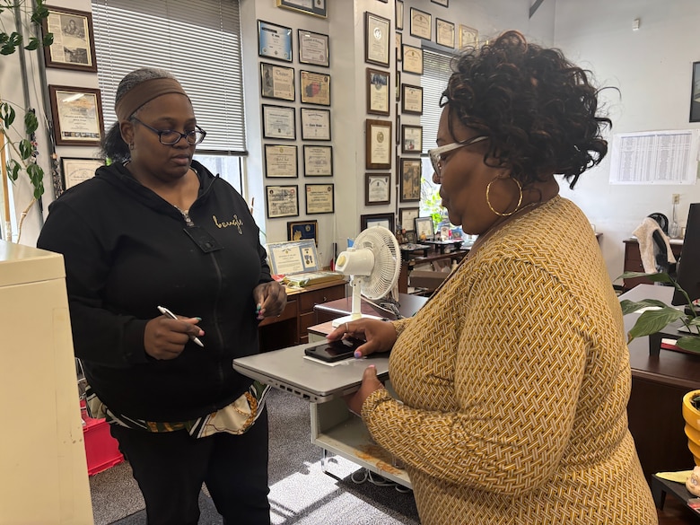 Shiron Bailey, a supply technician with the U.S. Army Corps of Engineers, Savannah District, facilitates an equipment turn-in appointment with Ava McCorkle, a budget Analyst with the Savannah District. Bailey manages inventory operations, including receiving, storing and issuing supplies.