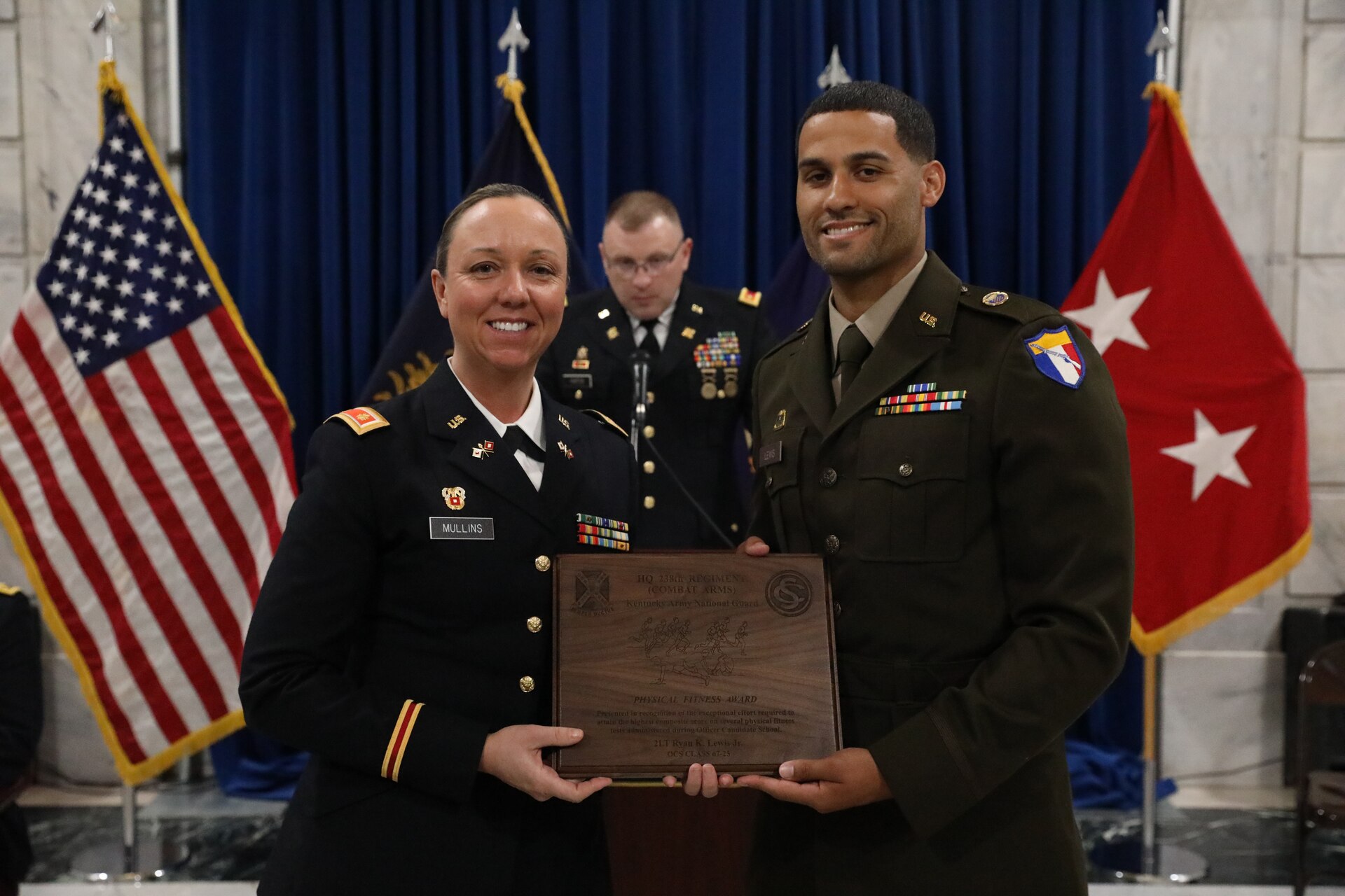 Winner of the Physical Fitness Award, U.S. Army 2nd Lt. Ryan Lewis, accepts the Kentucky Merit Ribbon for achieving the highest score on the final Army Combat Fitness test taken during his Officer Candidate School course.