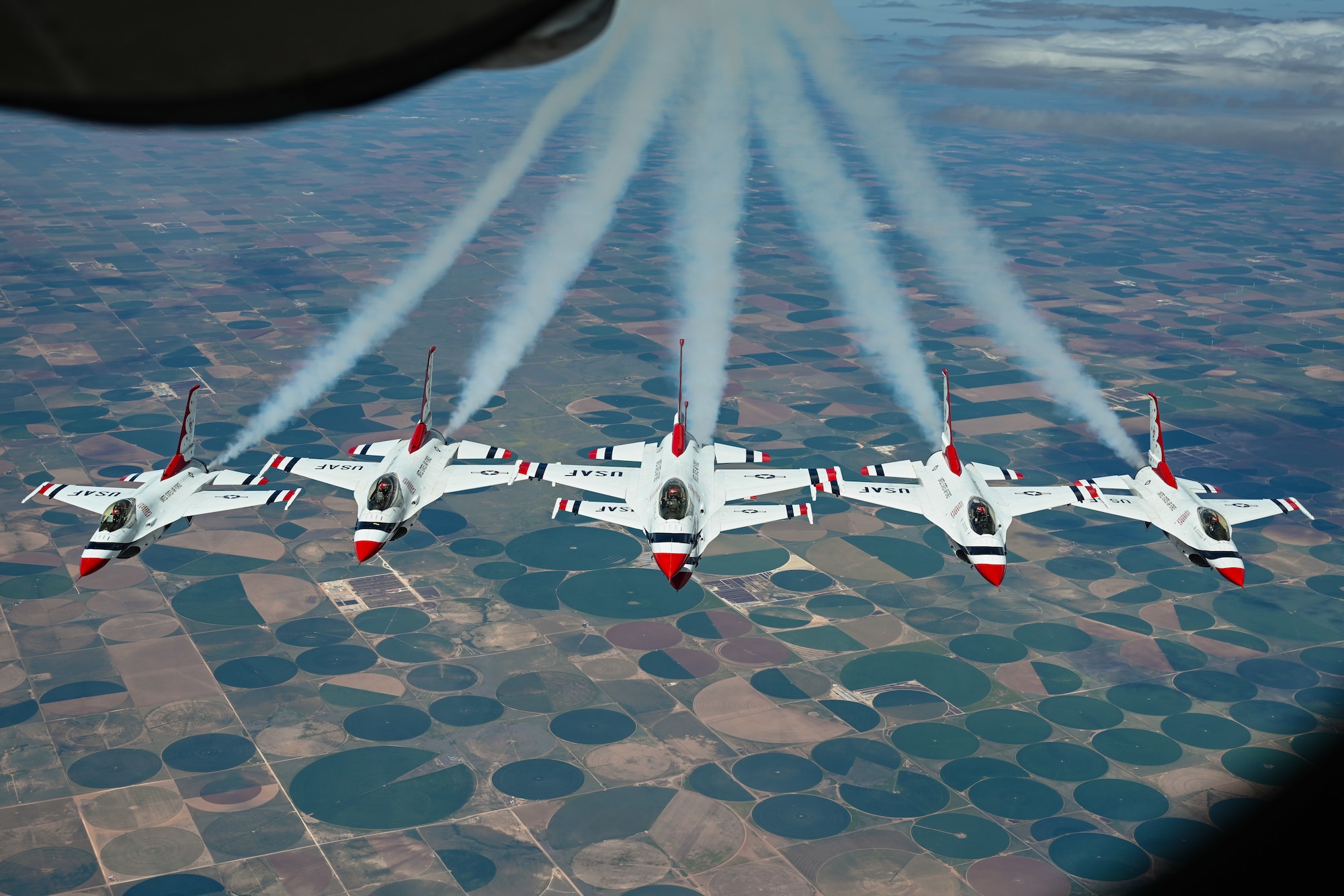 The U.S. Air Force Thunderbirds fly in formation after being refueled by a KC-135 Stratotanker aircraft assigned to the 54th Air Refueling Squadron (ARS) over Texas, April 17, 2025. The 54th ARS supported the Thunderbirds’ flight to the Wings Over West Texas Air Show at Dyess Air Force Base, Texas. (U.S. Air Force photo by Airman 1st Class Jonah Bliss)