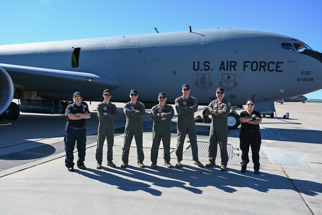 U.S. Air Force Airmen from the 54th Air Refueling Squadron and 97th Aircraft Maintenance Squadron pose for a photo in front of a KC-135 Stratotanker aircraft at Dyess Air Force Base, Texas, April 21, 2025. From left to right, the crew consists of Chad Clement, hydraulics specialist, Staff Sgt. Nick Belmonte, boom operator, Capt. Peter Kuzniewski, pilot, Capt. Jacob Cable, pilot, Capt. Connor Brown, pilot, Staff Sgt. Gage Fontenot, boom operator, and Julianne Martinez, crew chief. (U.S. Air Force photo by Airman 1st Class Jonah Bliss)
