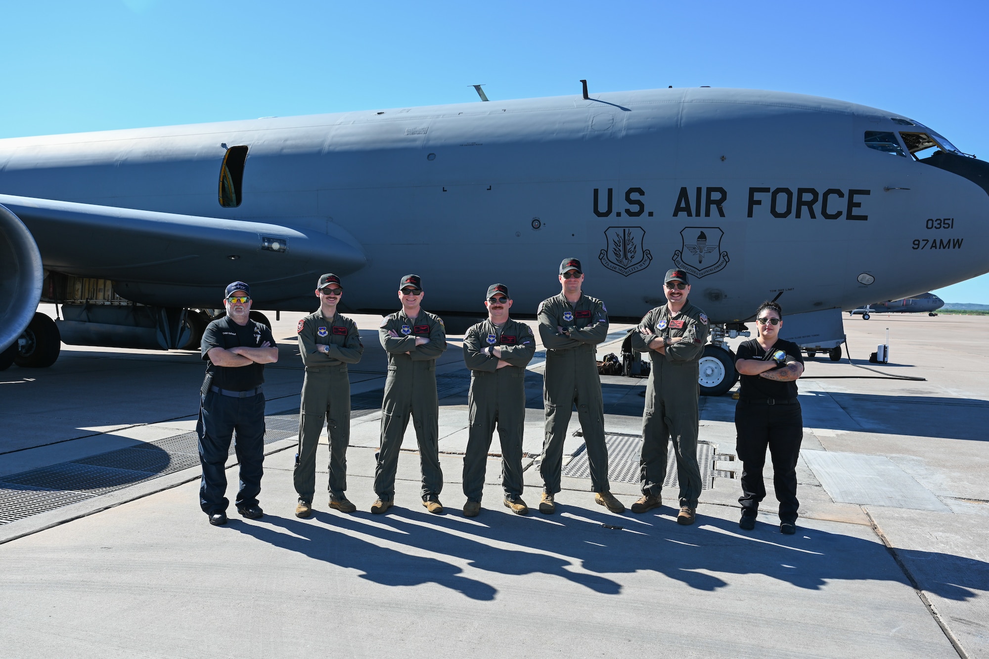 U.S. Air Force Airmen from the 54th Air Refueling Squadron and 97th Aircraft Maintenance Squadron pose for a photo in front of a KC-135 Stratotanker aircraft at Dyess Air Force Base, Texas, April 21, 2025. From left to right, the crew consists of Chad Clement, hydraulics specialist, Staff Sgt. Nick Belmonte, boom operator, Capt. Peter Kuzniewski, pilot, Capt. Jacob Cable, pilot, Capt. Connor Brown, pilot, Staff Sgt. Gage Fontenot, boom operator, and Julianne Martinez, crew chief. (U.S. Air Force photo by Airman 1st Class Jonah Bliss)