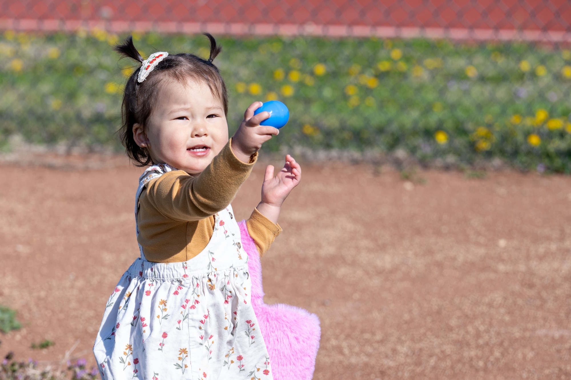 A McConnell child participates in an egg hunt during the Family Festival of Fun at McConnell Air Force Base, Kansas, April 12, 2025. Children and families enjoyed games and activities such as corn hole, egg hunts and pony rides to celebrate the Month of the Military Child. (U.S. Air Force photo by Airman 1st Class Paula Arce)