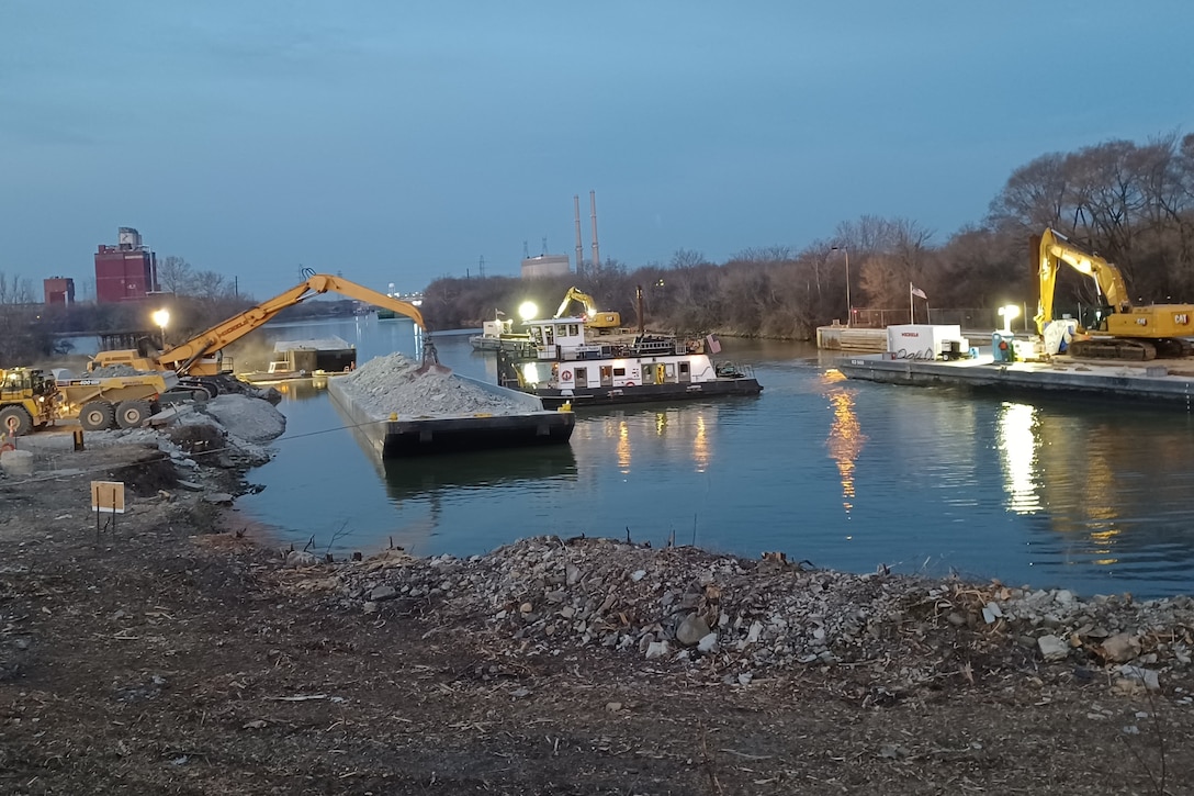 Contractors for the Brandon Road Interbasin Project work through the night to complete rock excavation in the channel of the Illinois Waterway.