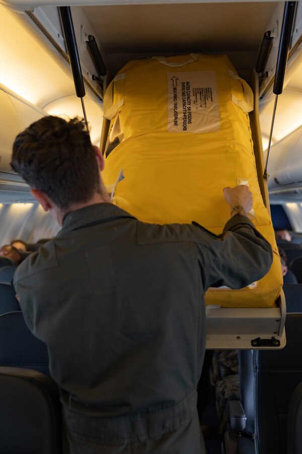 U.S. Marine Corps Lance Cpl. Kody Nowicki, a second loadmaster, with Marine Transport Squadron 1, Marine Aircraft Group 41, 4th Marine Aircraft Wing, Marine Forces Reserves, briefs instructions on how to retrieve a life raft aboard a C-40A assigned to VMR-1, during awhile flying over the Gulf of Papua, May 1, 2024. VMR-1 transported Marines and Sailors with Marine Rotational Force – Darwin 24.3 to Papua New Guinea in support of a humanitarian assistance and disaster relief exercise. The HADR exercise will be conducted in coordination with the Papua New Guinea Defence force and U.S. Embassy in Port Moresby, with a focus on projecting select role II medical, logistics, and Marine Air-Ground Task Force command and control capabilities off-continent, to validate HADR training and readiness. Nowicki is a native of Minnesota. (U.S. Marine Corps photo by Cpl. Migel A. Reynosa)