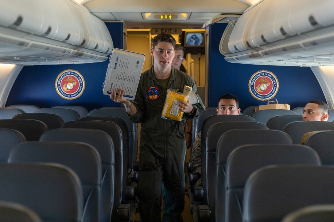 U.S. Marine Corps Lance Cpl. Kody Nowicki, a second loadmaster, with Marine Transport Squadron 1, Marine Aircraft Group 41, 4th Marine Aircraft Wing, Marine Forces Reserves, carries equipment to the front of a C-40A assigned to VMR-1, MAG 41, while flying over the Gulf of Papua, May 1, 2024. VMR-1 transported Marines and Sailors with Marine Rotational Force – Darwin 24.3 to Papua New Guinea in support of a humanitarian assistance and disaster relief exercise. The HADR exercise will be conducted in coordination with the Papua New Guinea Defence force and U.S. Embassy in Port Moresby, with a focus on projecting select role II medical, logistics, and Marine Air Ground Task Force command and control capabilities off-continent, to validate HADR training and readiness. Nowicki is a native of Minnesota. (U.S. Marine Corps photo by Cpl. Migel A. Reynosa)