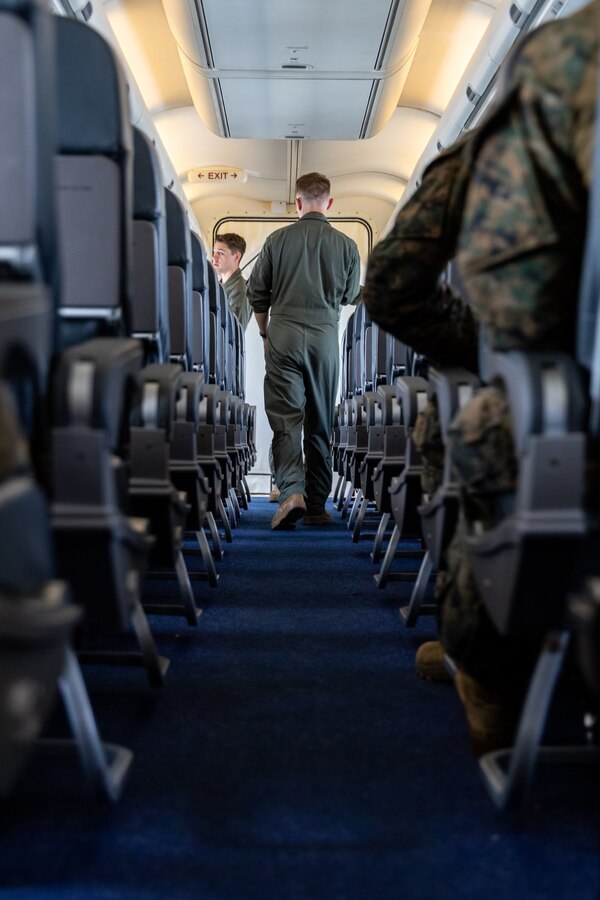 U.S. Marine Corps Sgt. David Craven, a C-40A load master, with Marine Transport Squadron 1, Marine Aircraft Group 41, 4th Marine Aircraft Wing, Marine Forces Reserves, walks to the front of a C-40A assigned to VMR-1, while flying over the Gulf of Papua, May 1, 2024. VMR-1 transported Marines and Sailors with Marine Rotational Force – Darwin 24.3 to Papua New Guinea in support of a humanitarian assistance and disaster relief exercise. The HADR exercise will be conducted in coordination with the Papua New Guinea Defence force and U.S. Embassy in Port Moresby, with a focus on projecting select role II medical, logistics, and Marine Air-Ground Task Force command and control capabilities off-continent, to validate HADR training and readiness. Craven is a native of Texas. (U.S. Marine Corps photo by Cpl. Migel A. Reynosa)