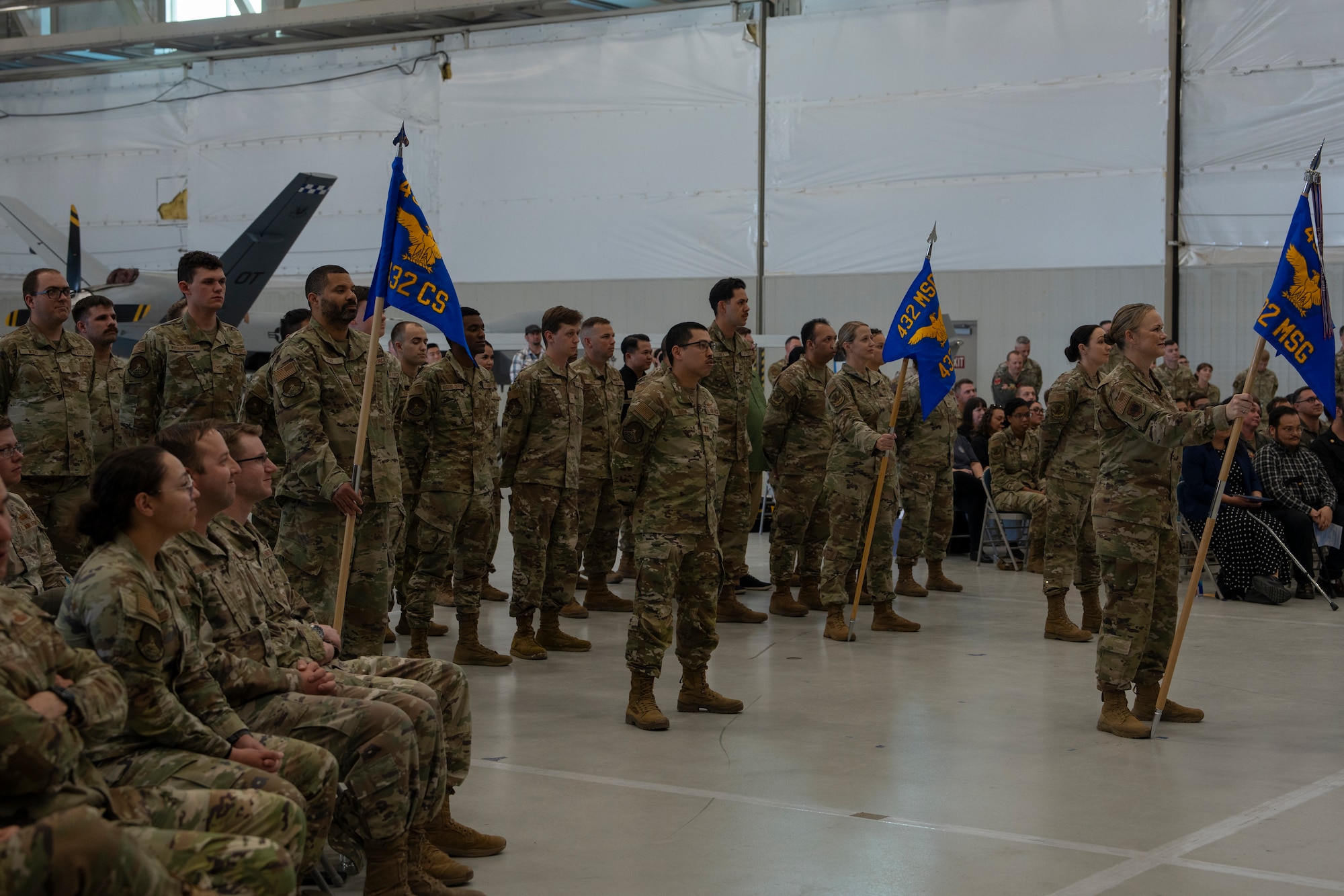Two squadrons stand at parade rest.