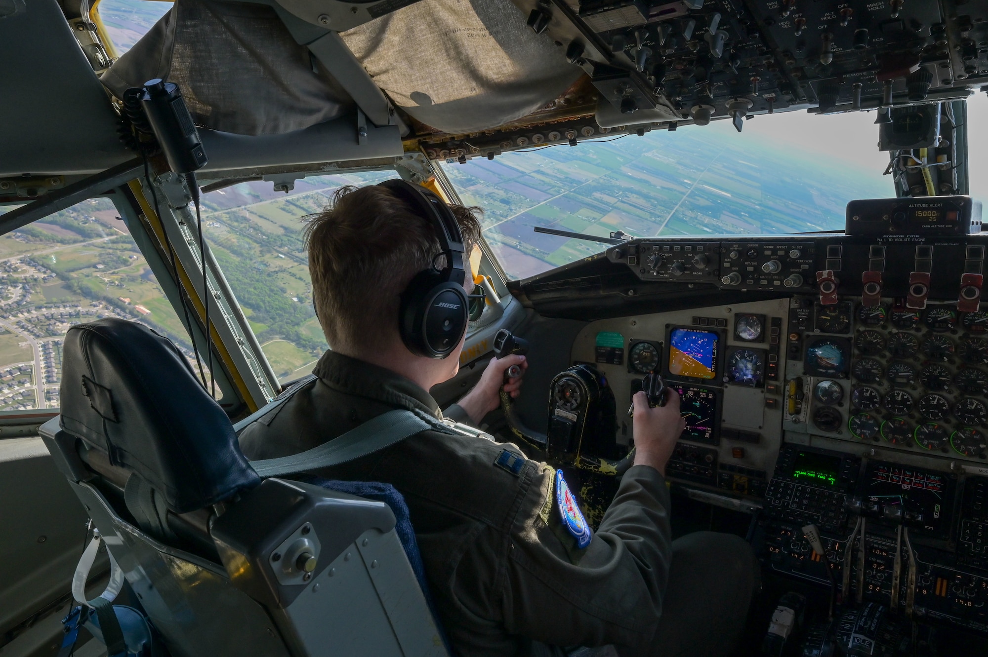 Capt. Augustus Bates, 350th Air Refueling Squadron KC-135 Stratotanker pilot, operates a KC-135 April 17, 2025, over Kansas. Bates participated in a low-level flying mission to build skills and confidence in preparation for U.S. Air Force Weapons School. (U.S. Air Force photo by Airman 1st Class Paula Arce)