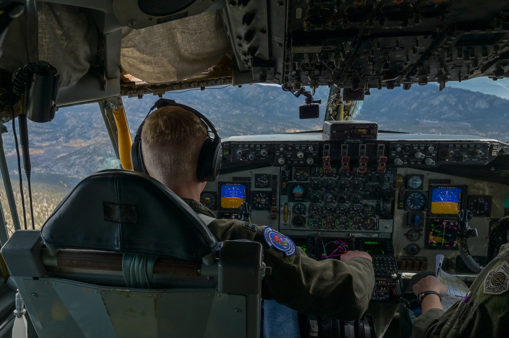 Capt. Luke Hartings, 350th Air Refueling Squadron KC-135 Stratotanker pilot, flies through mountainous terrain April 16, 2025, over California. Hartings participated in a low-level flying mission to build skills and confidence in preparation for U.S. Air Force Weapons School. (U.S. Air Force photo by Airman 1st Class Paula Arce)
