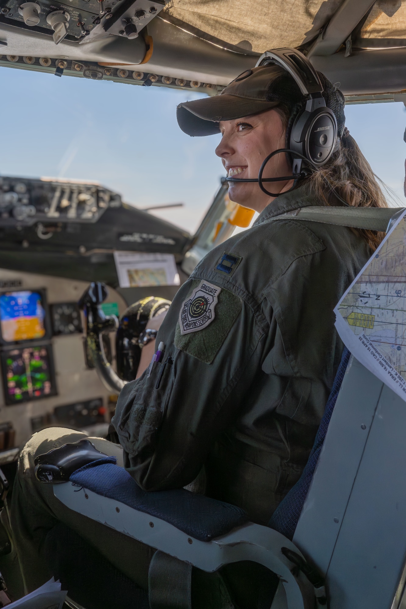 Capt. Rachel Kelly, 350th Air Refueling Squadron KC-135 Stratotanker pilot, provides instructions to students in a KC-135 April 17, 2025, over eastern California. Kelly is a U.S. Air Force Weapons School graduate and mentors future students. (U.S. Air Force photo by Airman 1st Class Paula Arce)
