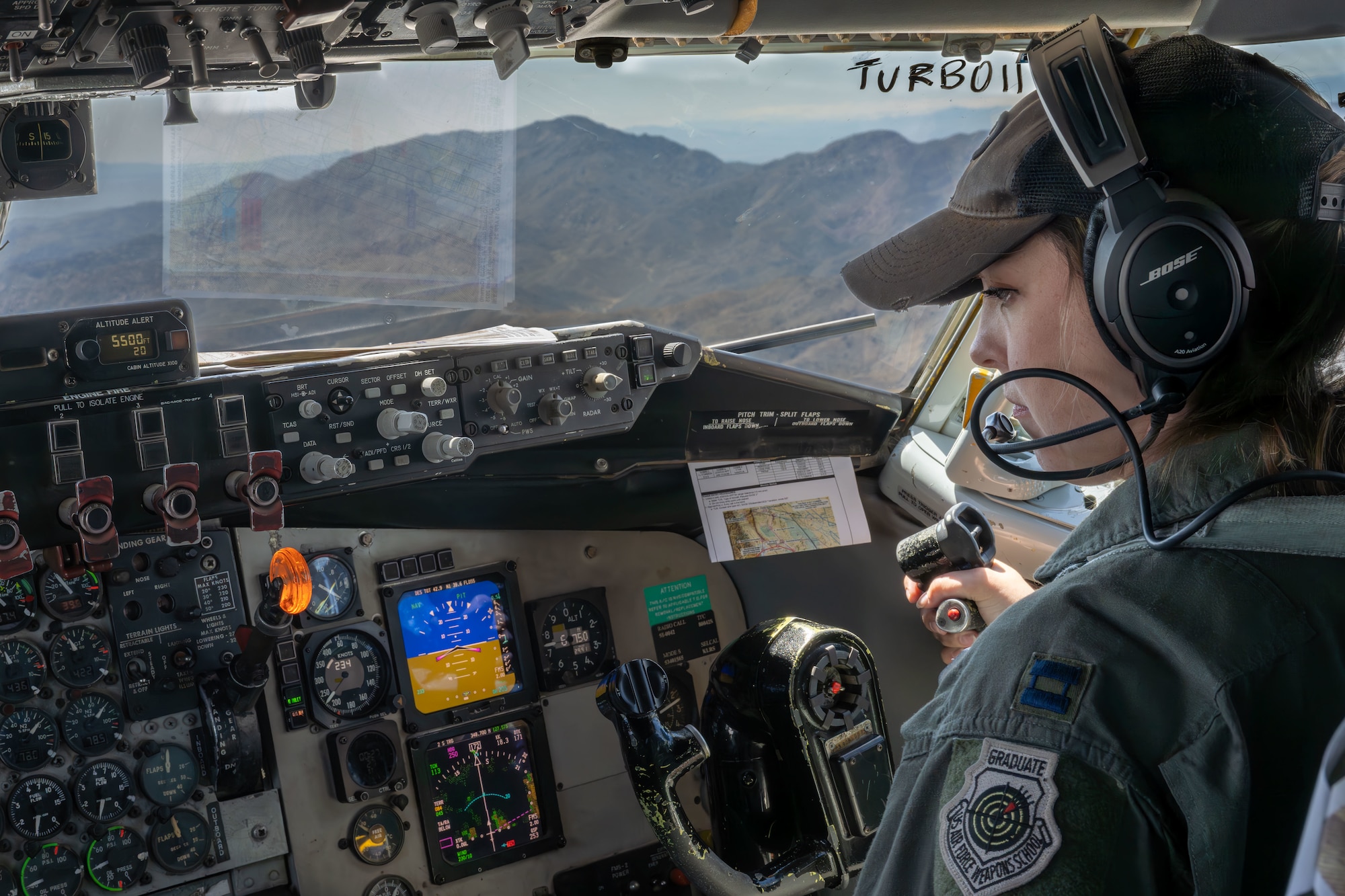 Capt. Rachel Kelly, 350th Air Refueling Squadron KC-135 Stratotanker pilot, navigates a KC-135 April 17, 2025, over eastern California. Kelly is a U.S. Air Force Weapons School graduate and mentors future students. (U.S. Air Force photo by Airman 1st Class Paula Arce)