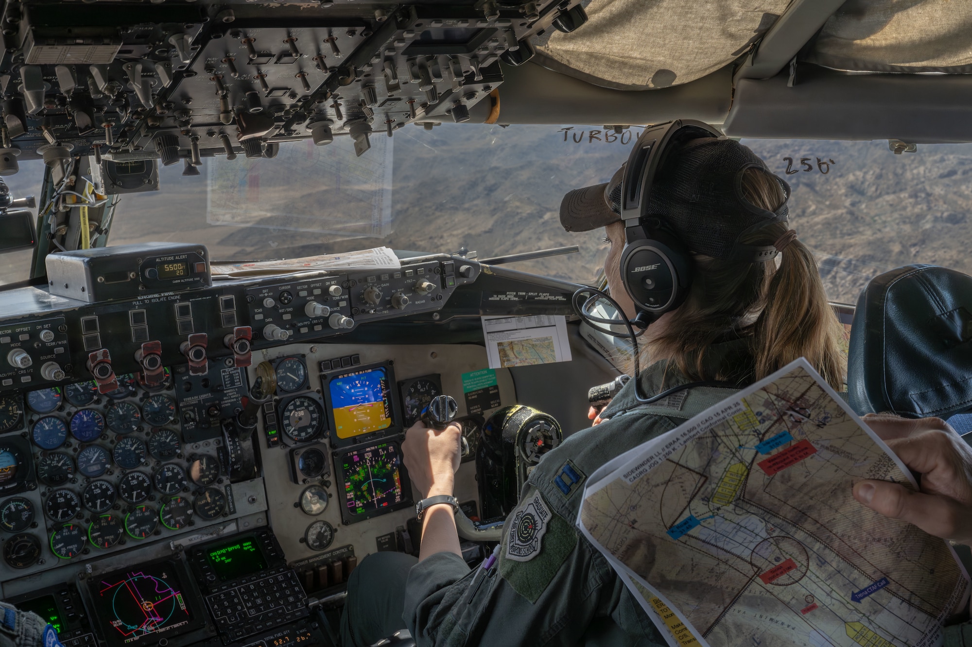Capt. Rachel Kelly, 350th Air Refueling Squadron KC-135 Stratotanker pilot, navigates a KC-135 April 17, 2025, over eastern California. Kelly is a U.S. Air Force Weapons School graduate and mentors future students. (U.S. Air Force photo by Airman 1st Class Paula Arce)