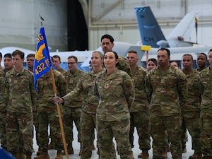 The Force Support Squadron stands at parade rest.