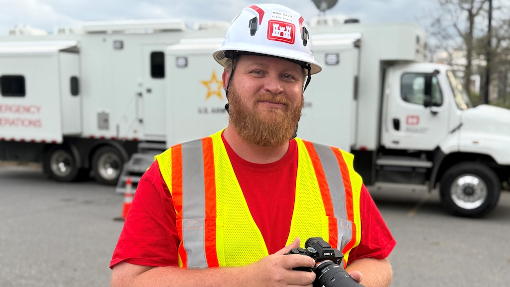 Mike Davis, U.S. Army Corps of Engineers Nashville District Public Affairs specialist, works at an emergency command and control vehicle April 21, 2025, while deployed in support of Hurricane Helene response efforts in Asheville, North Carolina. Davis is the Nashville District Employee of the Month for February 2025. (USACE Photo by Bobby Petty)