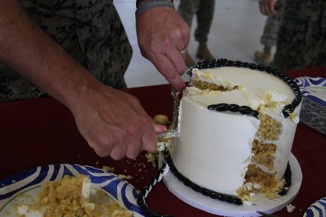 U.S. Marine Corps Sgt. Maj. Carl Woods, the senior-enlisted leader with Marine Transport Squadron 1 (VMR-1), cuts the birthday cake during the 73rd Birthday Celebration of VMR-1 on Naval Air Station (NAS) Joint Reserve Base (JRB) Fort Worth, Fort Worth, Texas, Oct. 04, 2024. The celebration was held to recognize the impact VMR-1 has had on the Fleet Marine Corps, Marine Corps Installation Command and the Marine Corps over the past 73 years. (U.S. Marine Corps photo by Sgt. Kree Laing)