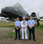 Airman 1st Class Wesley Davies (left), Hospital Corpsman First Class Corey Davies (middle) and Airman 1st Class Owen Davies (right) pose for a picture in front of a A-10 Thunderbolt II after graduating Air Force Basic Training. (Courtesy photo)